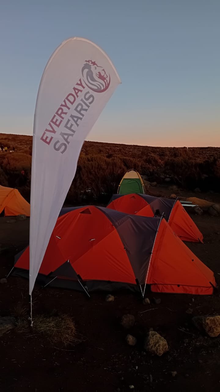 Kilimanjaro mountain team above the clouds