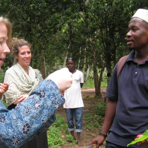 International traveller speaking with local cultural guide in tanzania