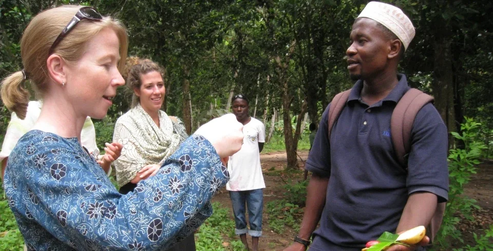 International traveller speaking with local cultural guide in tanzania