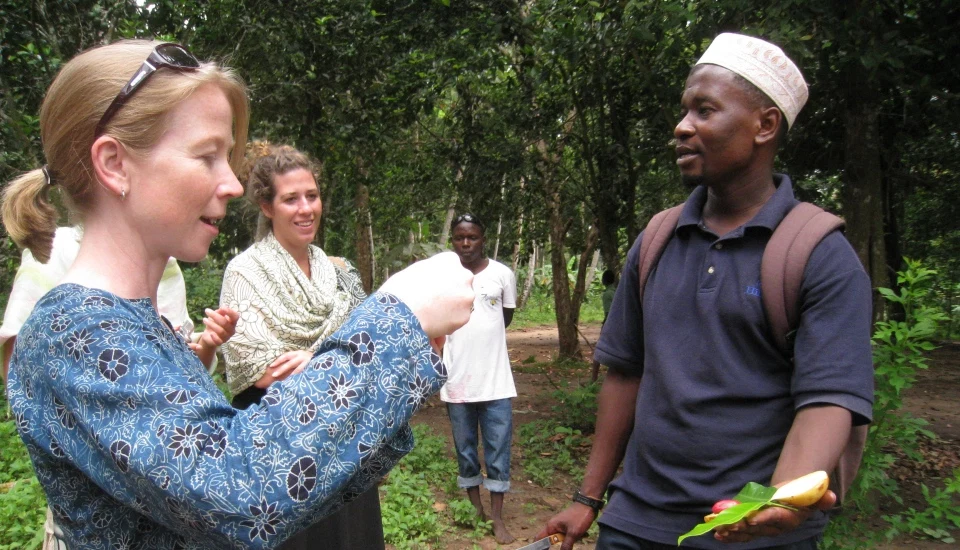 International traveller speaking with local cultural guide in tanzania