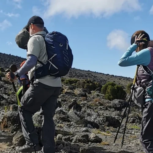 Kilimanjaro lemosho route climbers crossing rocky high altitude terrain