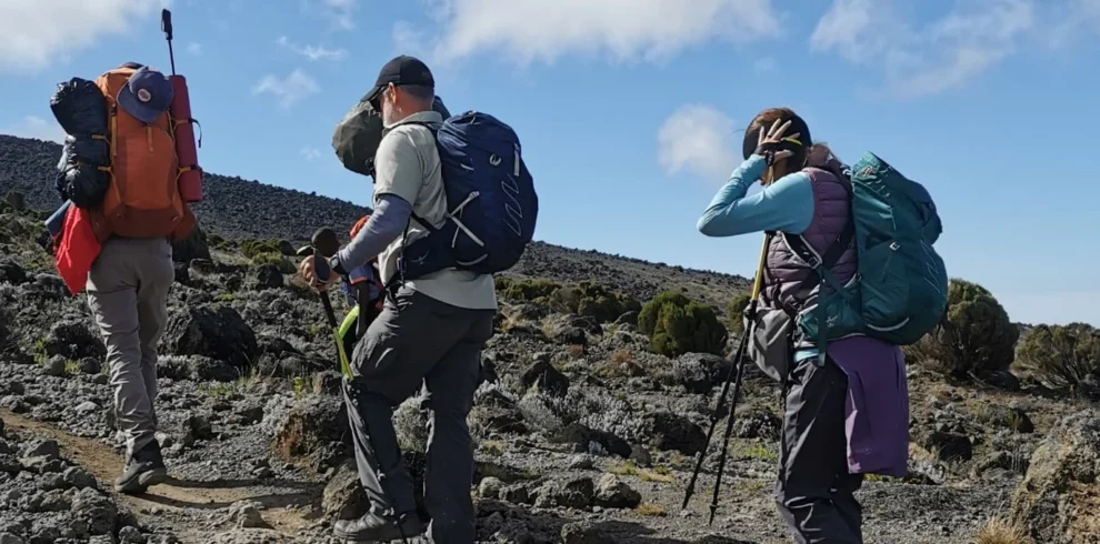 Kilimanjaro lemosho route climbers crossing rocky high altitude terrain