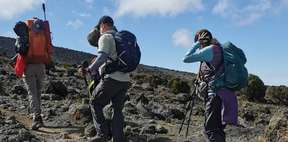 Kilimanjaro machame route climbers crossing rocky alpine desert