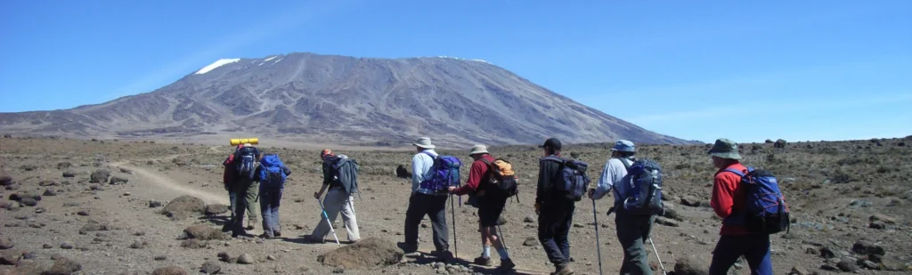 Kilimanjaro rongai route climbers crossing open alpine desert tanzania