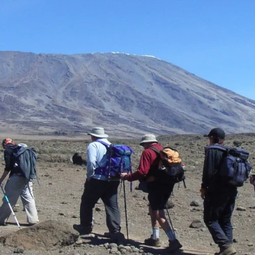 Kilimanjaro rongai route climbers crossing open alpine desert tanzania