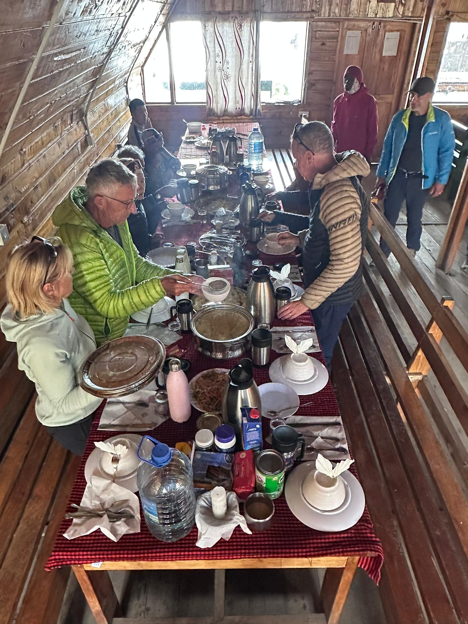 Kilimanjaro climbers sharing a mountain meal during a group climb in Tanzania