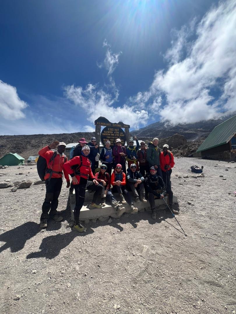 Kilimanjaro climbers crossing high-altitude alpine desert terrain