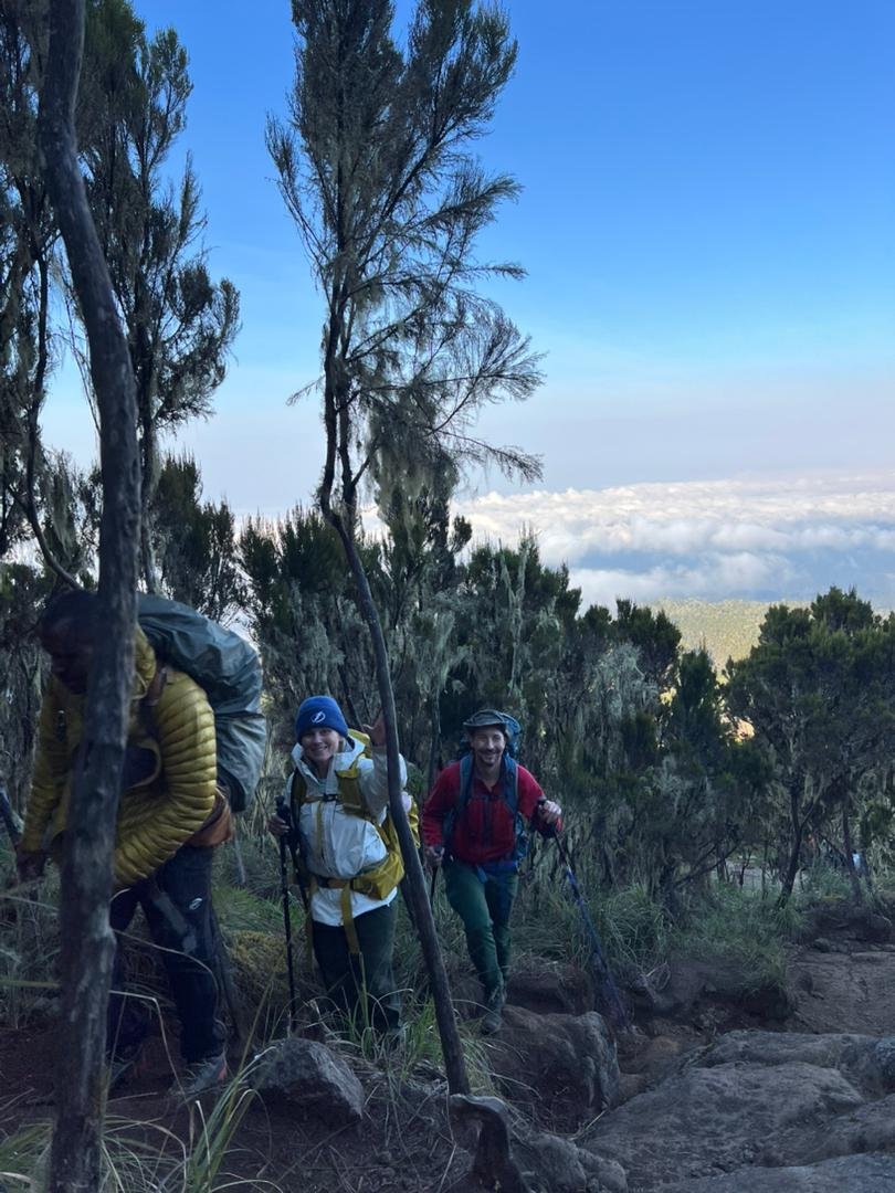 Kilimanjaro trekkers above the clouds on a private mountain trail