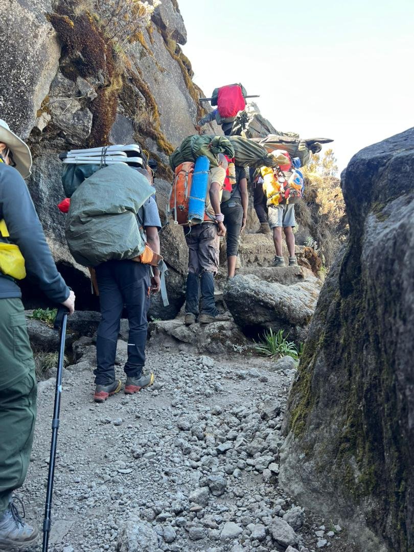 Kilimanjaro Machame Route hiking group on rocky mountain path