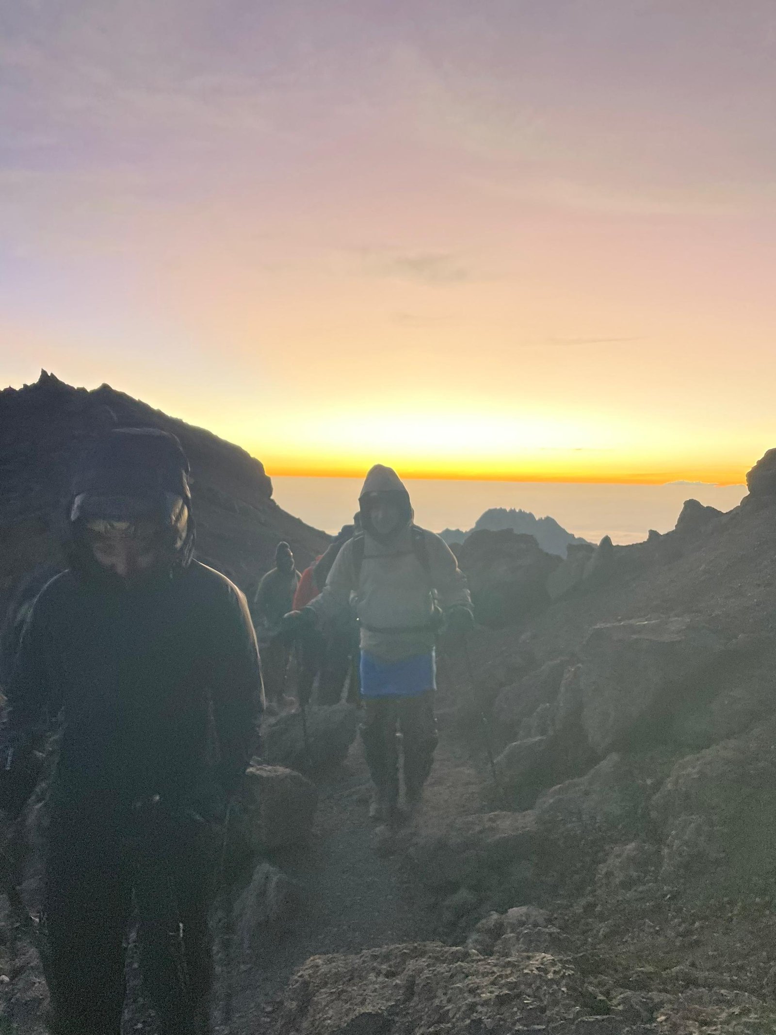 Climbers crossing snow-covered high-altitude terrain on Kilimanjaro