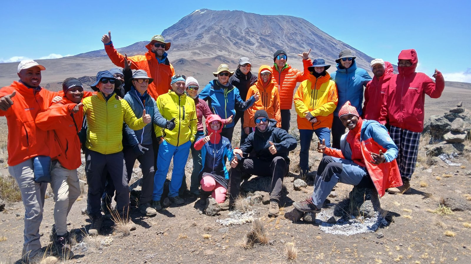 Kilimanjaro climbing team with Kibo mountain behind them