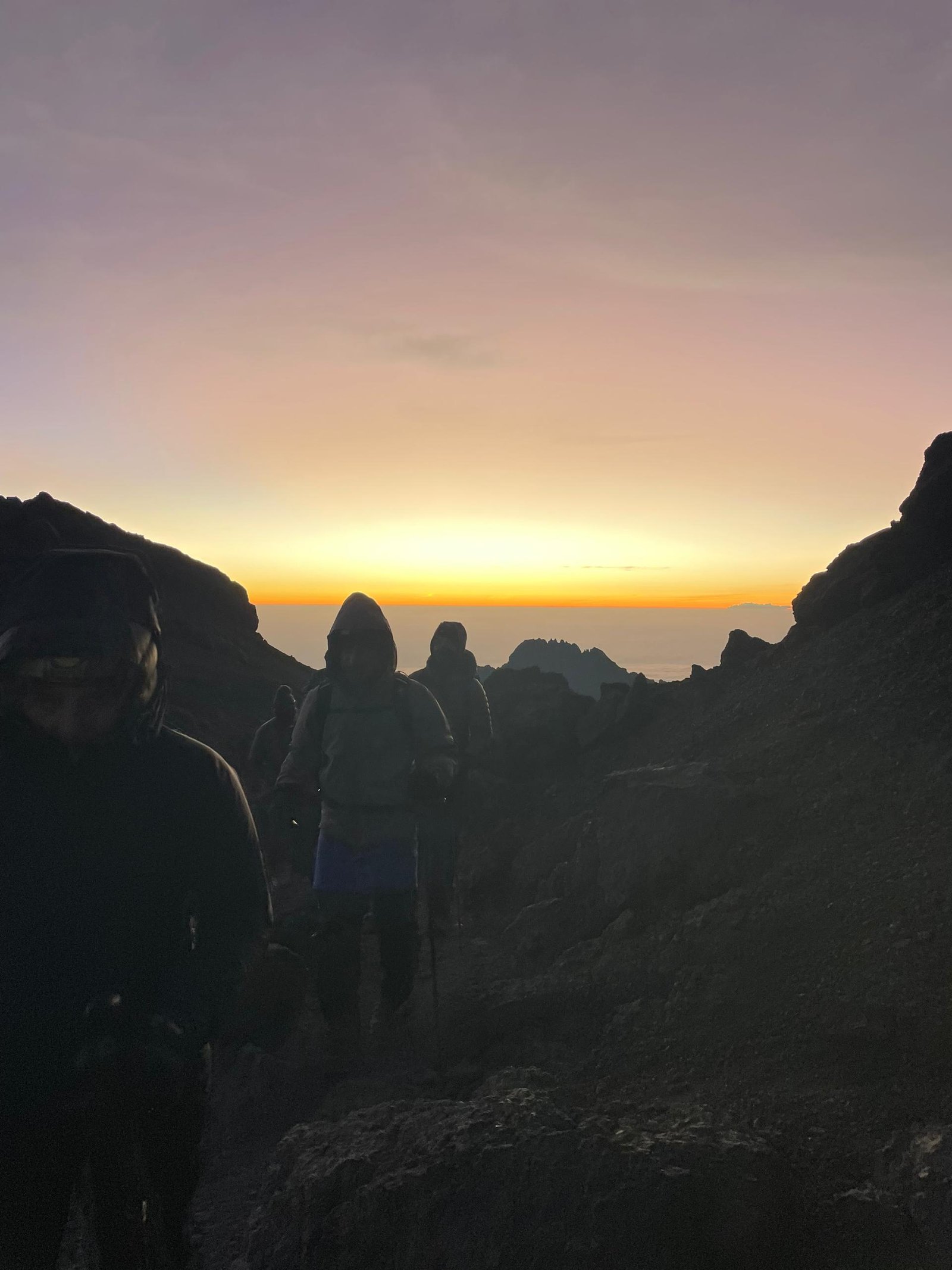 Kilimanjaro trekkers at dawn during a shared summit journey