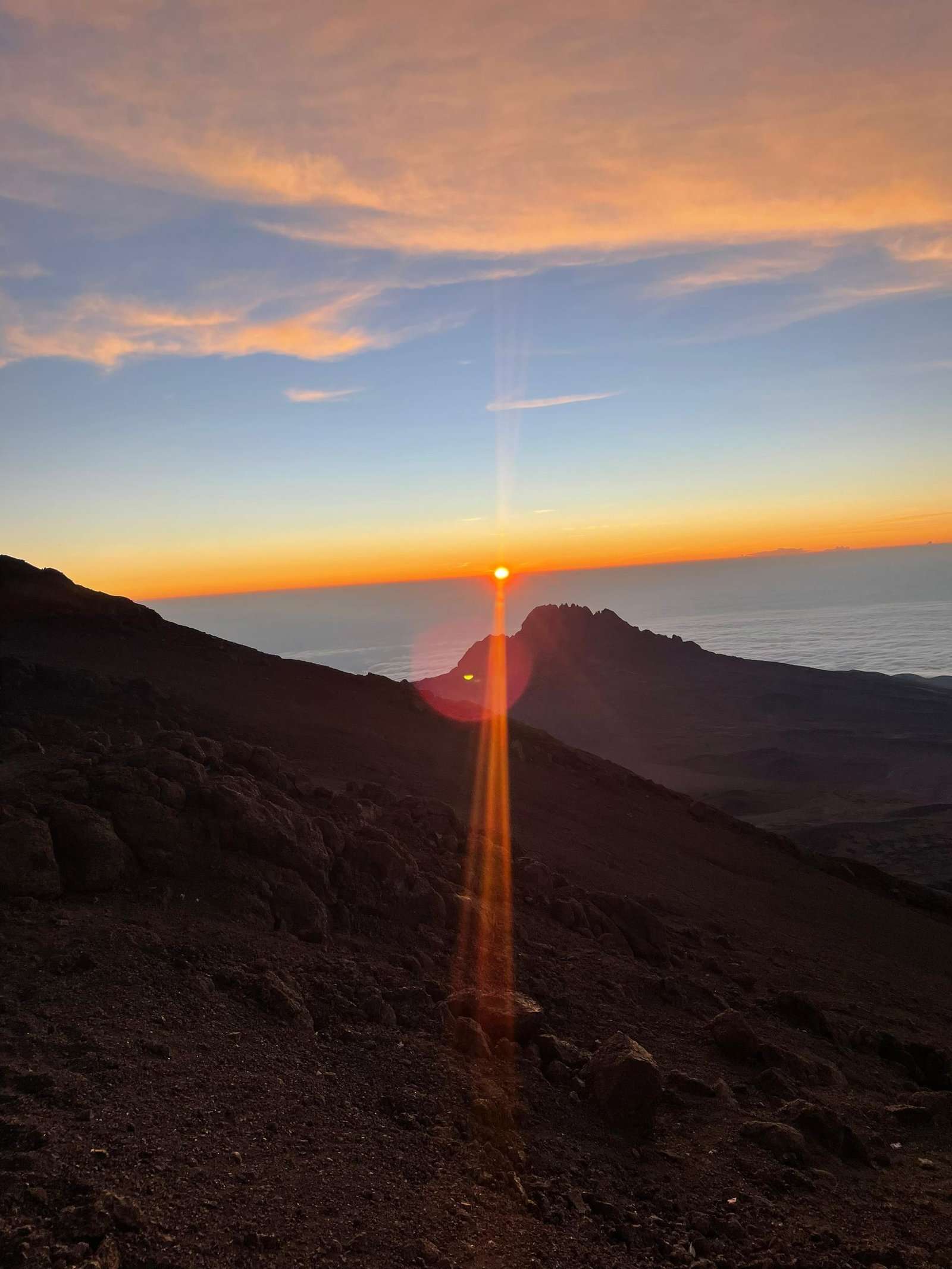 Sunrise over Mount Kilimanjaro during a group summit journey