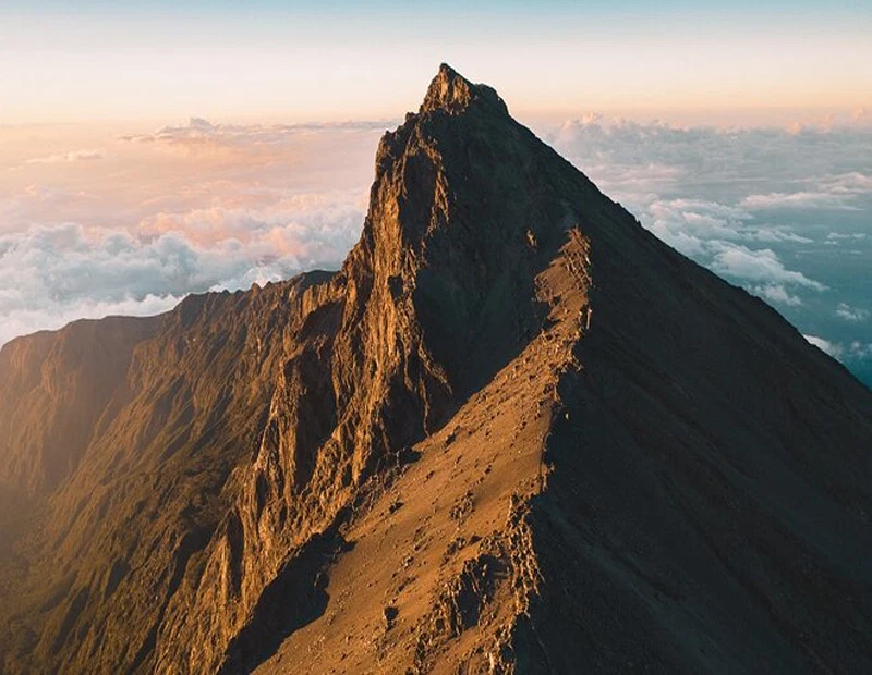 Mount meru socialist peak rugged summit ridge at golden sunrise