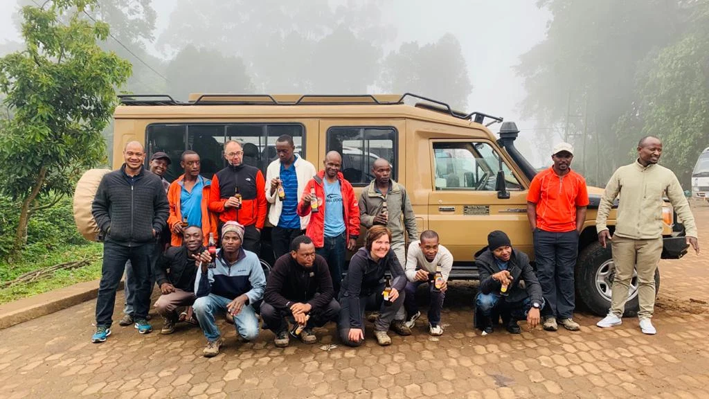 Tanzania Safari Guests And Guides With Four Wheel Drive Vehicle 1