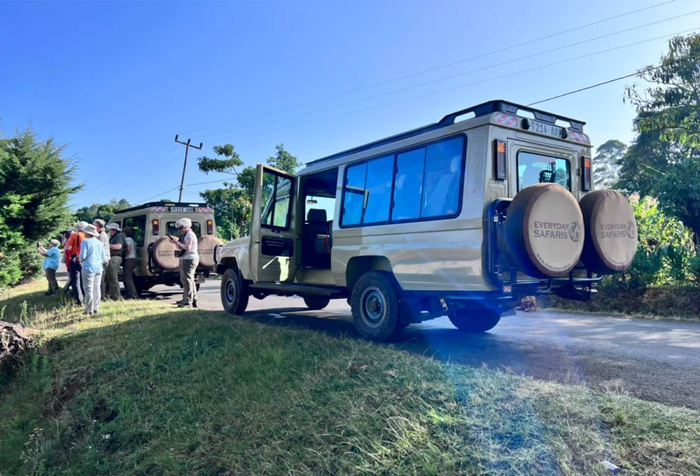 Family safari guests travelling in a private Tanzania game-drive vehicle