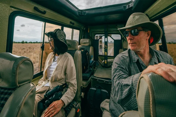 Tanzania Safari Guests Inside Four Wheel Drive Vehicle During Game Drive 1