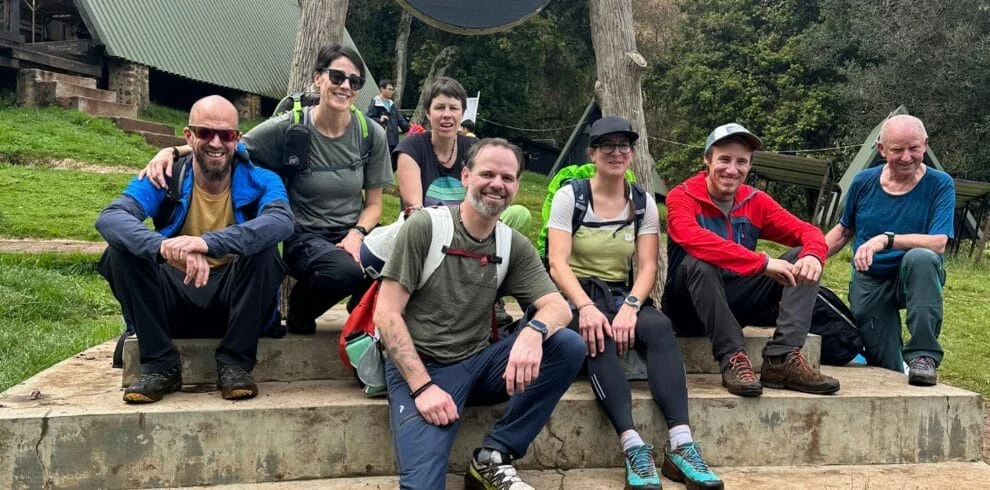 Tanzania Safari Guests Relaxing With Local Travel Team After Adventure 1