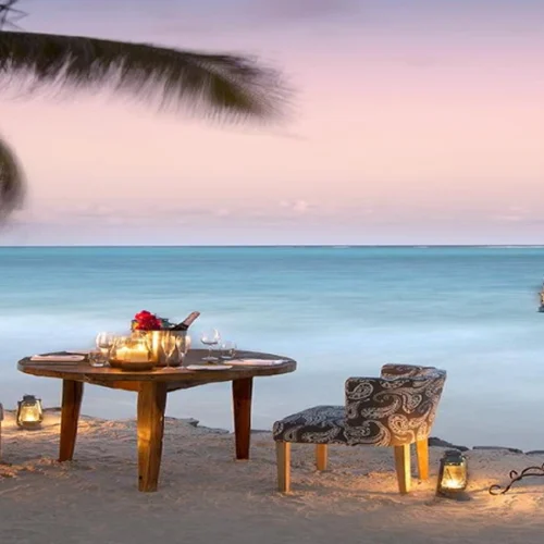Romantic Zanzibar beach dinner at sunset beside the Indian Ocean