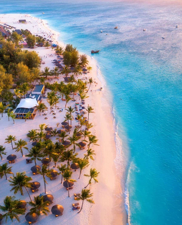 Zanzibar Tropical Coastline White Sand Beach And Turquoise Ocean Aerial View